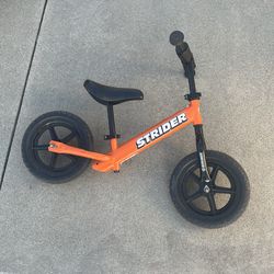 Strider 12” balance bike orange