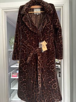 A warm leopard-print coat imported directly from Russia. The coat’s size is 42 (US 10) which refers to M size in clothes. The item is brand new with a
