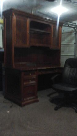 executive desk and hutch and side return with a glass misperception shelf and lighting