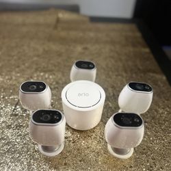 Netgear Arlo Wire-Free HD Security Cameras and magnetic mounts.