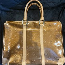 Beautiful bronze embossed monogram leather handbag in great condition. 