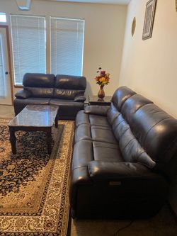 Brown Leather Reclining Sofa and Loveseat Set