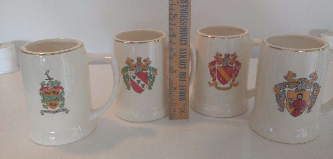 SET OF 4 STEINS WITH COAT OF ARMS