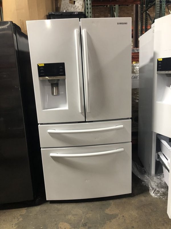 DENTEDSAMSUNG 33 IN. W 24.73 CU. FT. 4DOOR FRENCH DOOR REFRIGERATOR