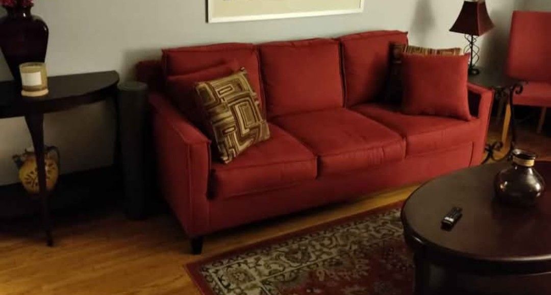 2 Sofas. From Bob's Furniture 1 Is Sleeper