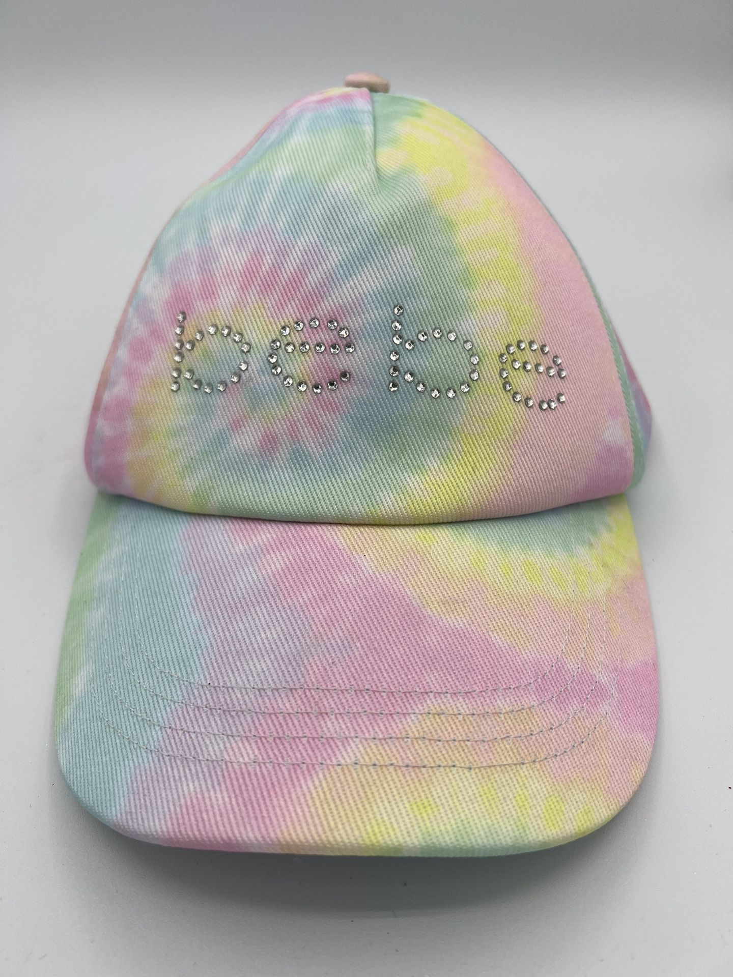 Bebe girls hat tye dye pink.  Teenagers will fit excellent condition  Brand BEBE in rhinestones  Comes from a pet and smoke free household  B29 