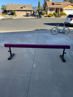Adjustable gymnastics balance beam