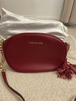 Michael Kors crossbody bag with gold tassel