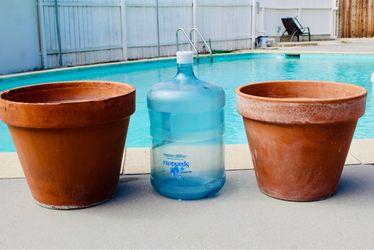 A pair of made in Italy terracotta pots