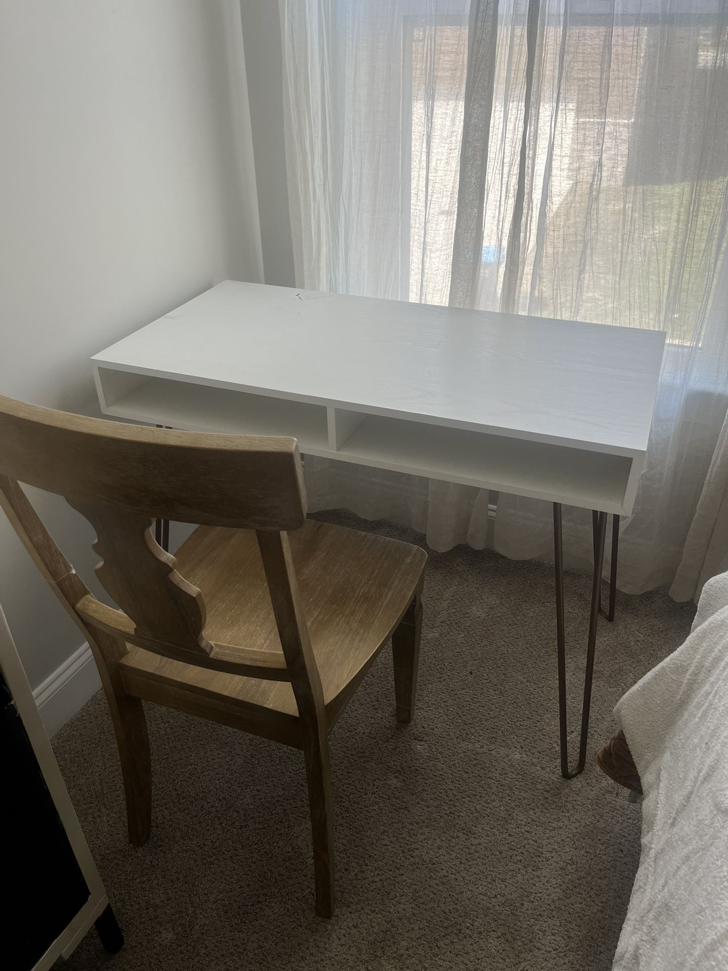 white desk and wooden chair