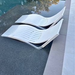 A Set Of Pool Ledge Loungers