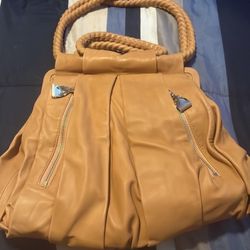 EUC 100% Christian Loub Purse