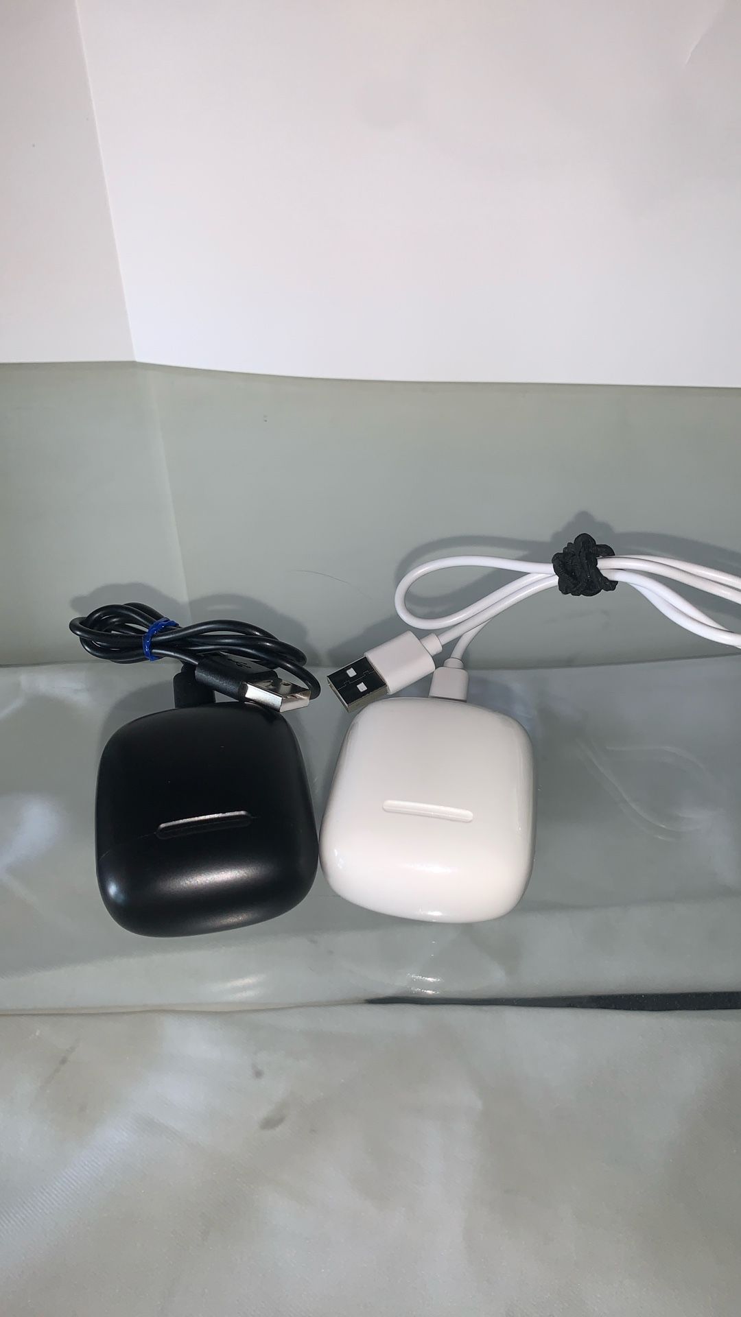 2 Sets of Bluetooth Earbuds – White & Black (Each with Charger)
