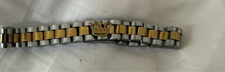 Two tone bracelet with crown in center
