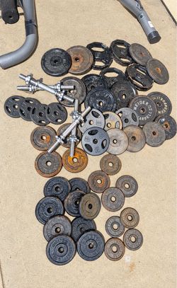 Standard weights 305lbs total plus two pairs of adjustable handles