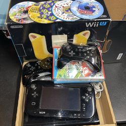 Wii U with games and controllers