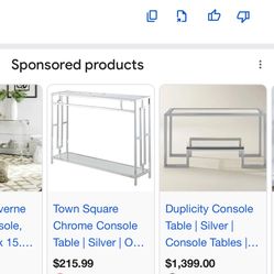 Town Square Chrome Glass Console Table. It is a contemporary-style piece