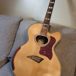 Kona jumbo cutaway body acoustic guitar.  Plays and sounds nice
