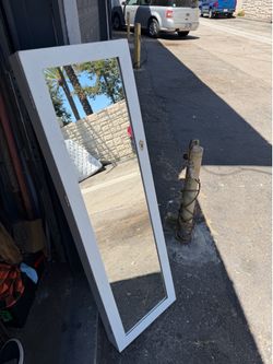 Mirror/jewelry storage