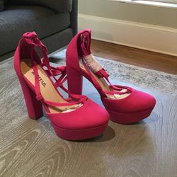 Brand new, really high faux suede hot pink platform heels