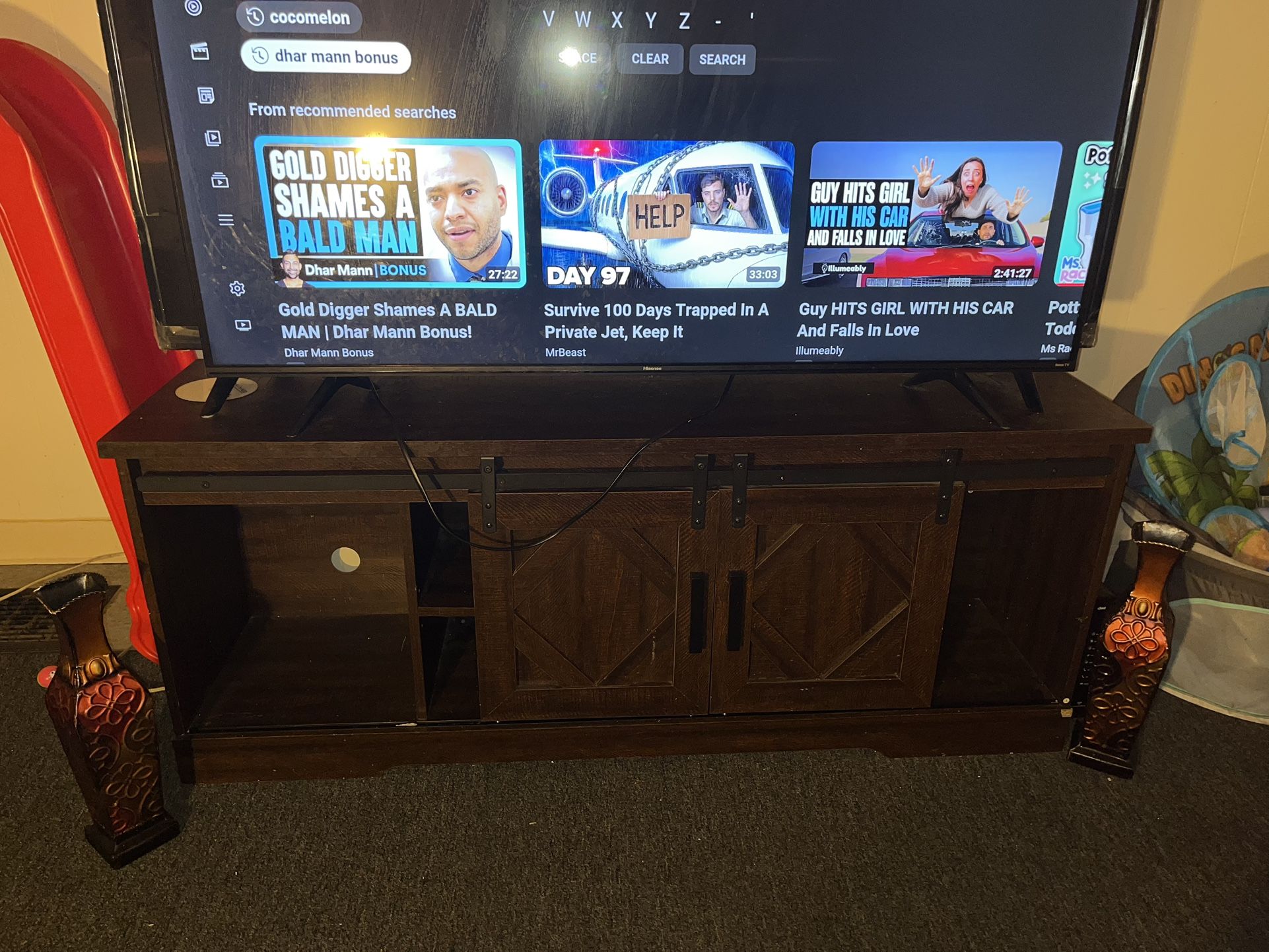 Brown wooden cabinet tv stand