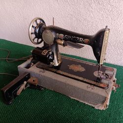 Antique Singer Sewing Machine fitted with working electric motor.