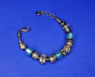 Silver Charm Bracelet with Blue Beads