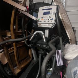 TRUE Elliptical workout machine, Color Grey. 