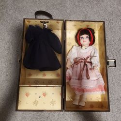 Vintage porcelain doll in case with 3 extra outfits and 2 pairs of shoes,Like New 