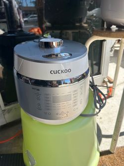 Cuckoo CRP-EHSS0309F Smart IH pressure rice cooker with a stainless steel inner pot and voice navigation