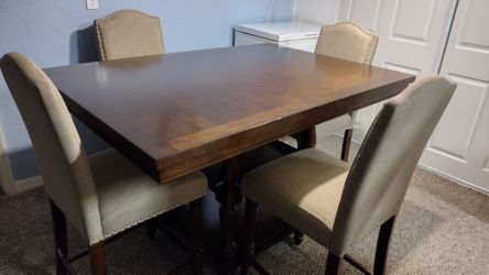 Beautiful genuine wood dinner table and four chairs