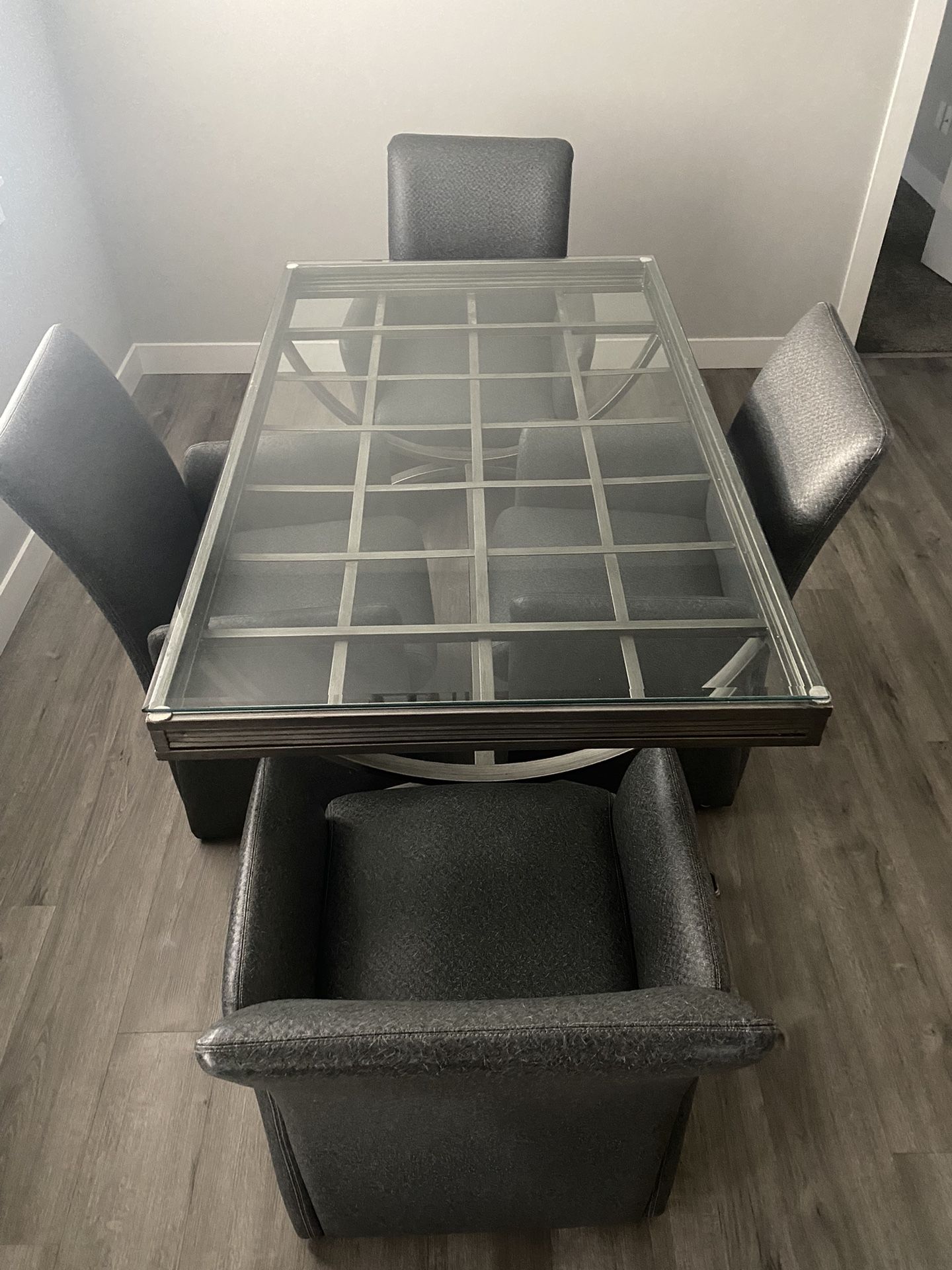 Modern Glass Top Dining Table with 4 Rolling Chairs