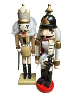 2nutcrackers 10” no original box one of them has missing nose look at photos for wear