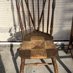 antique Windsor-style side chair woven rush seat and a brace-back spindle design