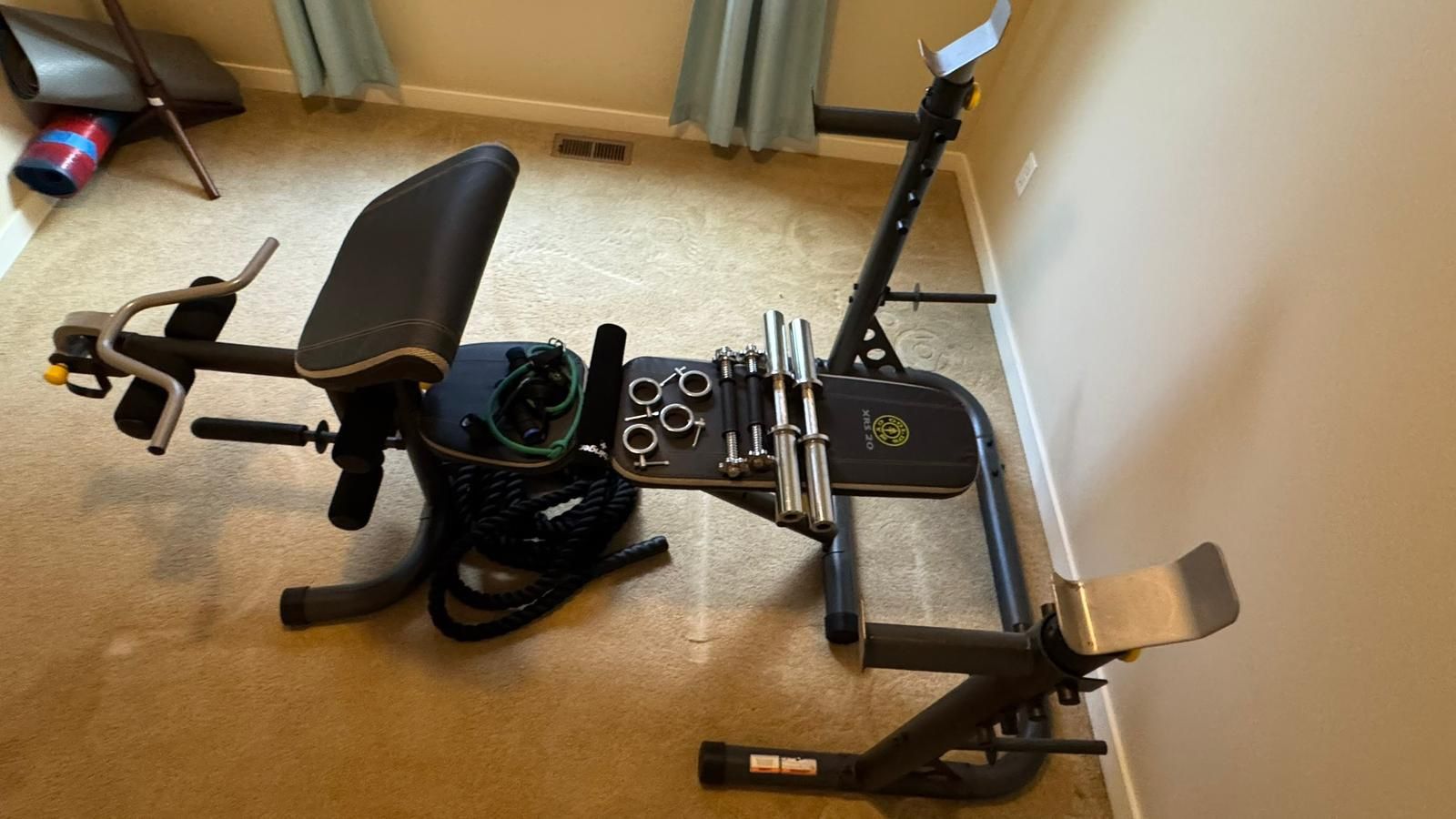 Gold Gym workout bench and rack,plus dumbbell bars , squat neck pad and resistance band.