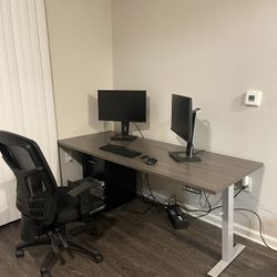 Work station with height adjustable desk