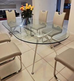 Racetrack style glass dining table 6