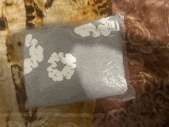 Grey denim tear