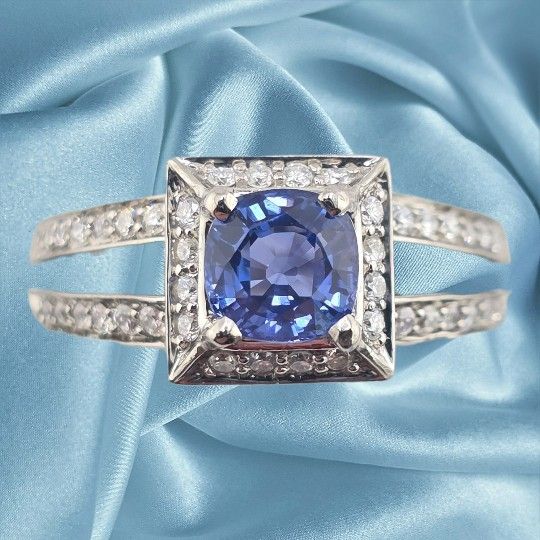 Palladium ring with 1.03ct cushion cut sapphire and 0.50ctw diamonds.