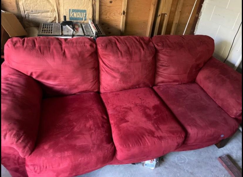 Red couch and loveseat