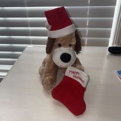 Cute Brown Christmas Puppy with Santa Hat and Happy Holidays Stocking