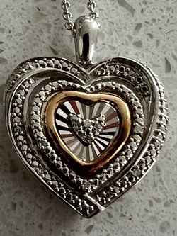 Diamond accent, two tone, heart pendant necklace in Sterling silver and 10k gold