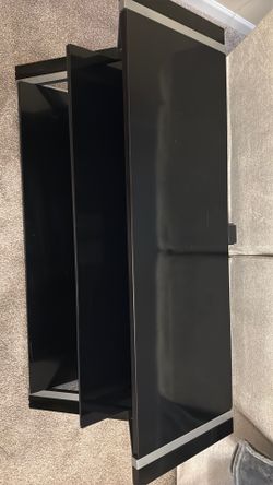 Black and silver tv stand. Must pickup