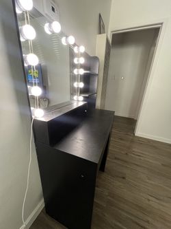 Vanity with lights and mirror