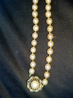 Real pearl necklace with Sterling silver and Stones.