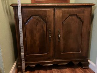 Wooden cabinet with glass top protector