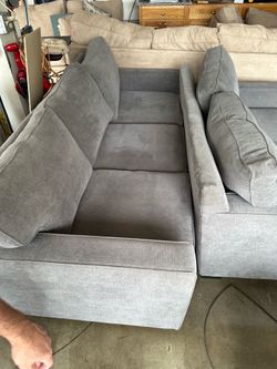 Macy's Brand Radley Sectional sofas in a gray fabric.