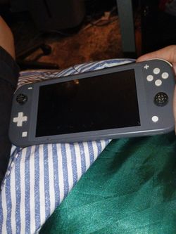 Nintendo switch lite cool grey used with right joystick broken everything else is perfectly normal