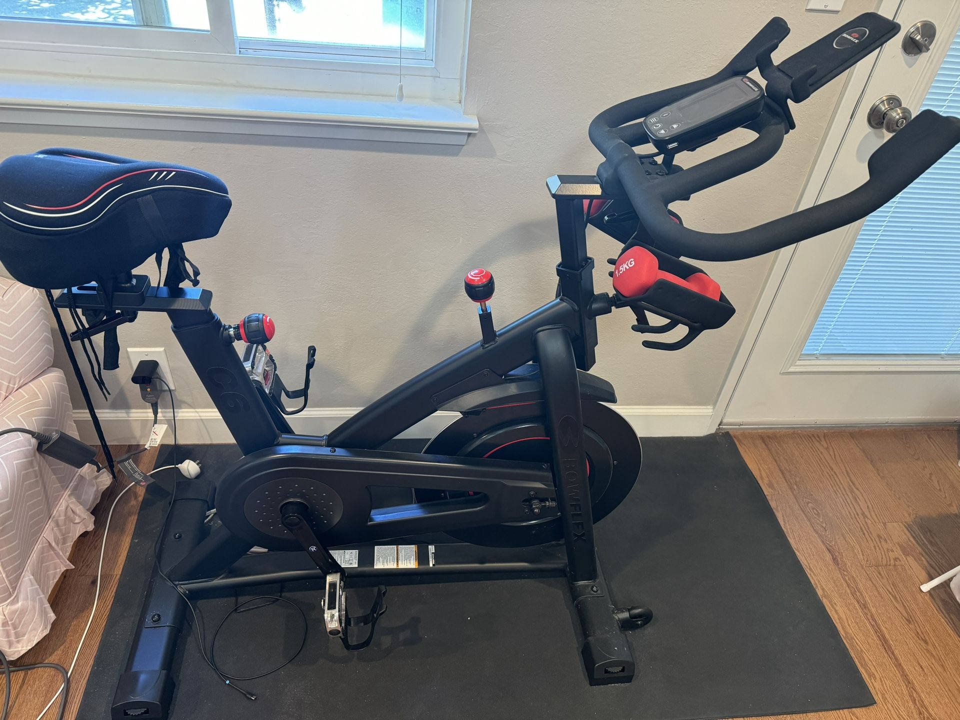 BowFlex C6 Stationary Bike with mat and bike seat cover