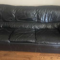 Leather couch And Old Dresser